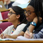 Students focusing while in a lecture. 